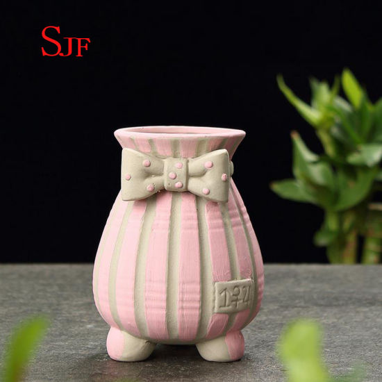 Pot de fleurs peint à la main créatif simple en céramique.