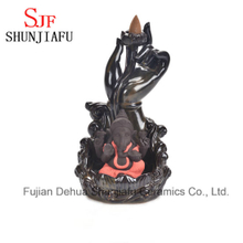 Brûleur d'encens en céramique Ganesh assis sur la scène Lotus