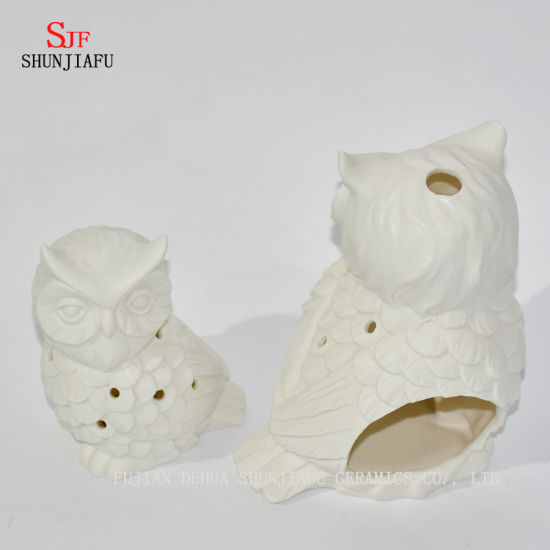 Bougeoirs en céramique en forme de hiboux / a