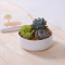 Petit pot de fleurs rond en céramique