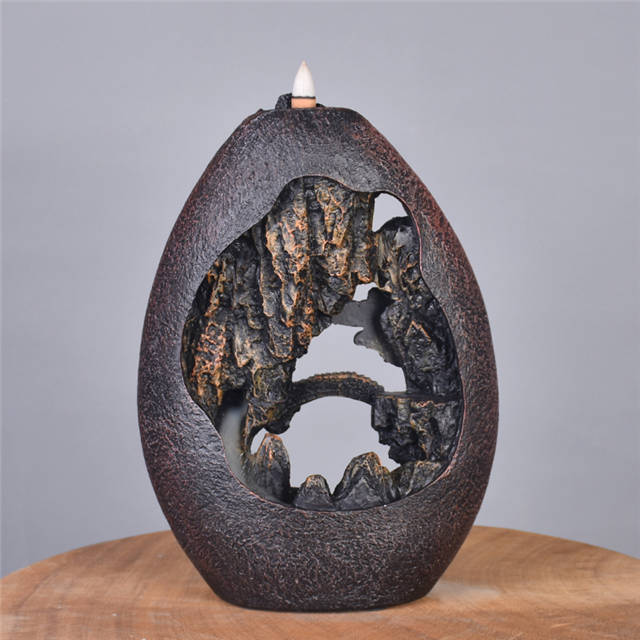 Brûleur d'encens à refoulement de conception de paysage de printemps rural