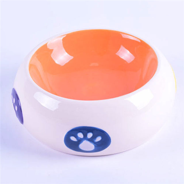 Bol à l'intérieur du bol orange à l'extérieur du tambour blanc empreintes de pas imprimées en céramique bol pour chien en céramique