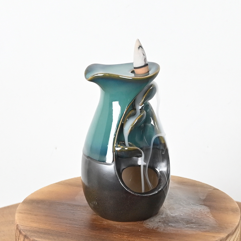 Conception de style vase encens en cascade en céramique brûleur d'encens de débit en céramique