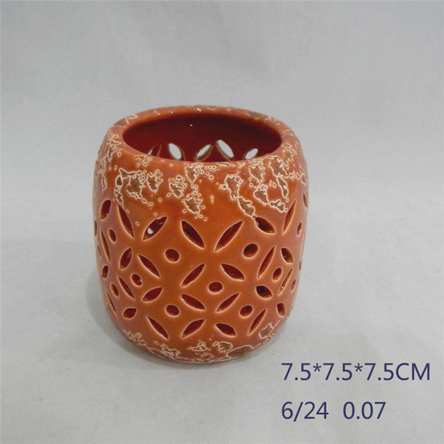 Décoration d'ameublement orange rouge cylindre en céramique forme de bande de style évidant lanterne en céramique d'ouragan