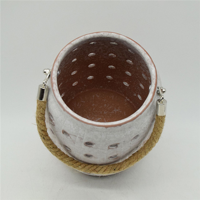 Star Lighting Meilleure vente nouveau cylindre en céramique de couleur évidant le style de moulin à vent évidant la lanterne d'ouragan