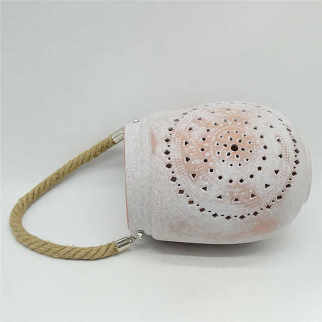 Cylindre en céramique évidant le style de moulin à vent évidant la lanterne d'ouragan