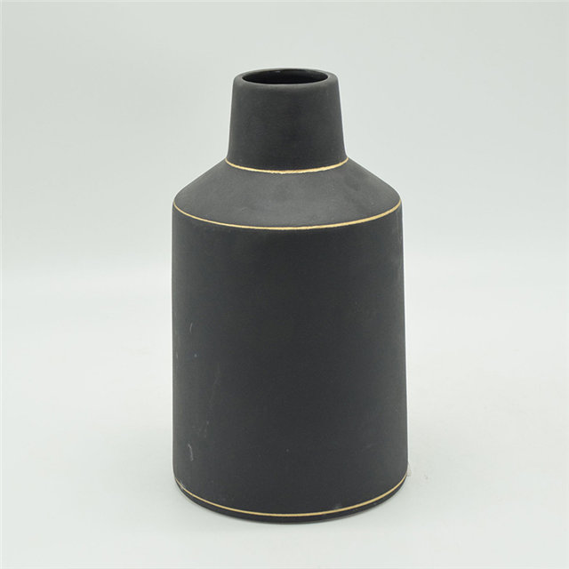 Vase en céramique noire d'or coloré de style de rugby de points blancs de style moderne