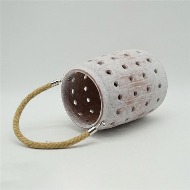 Star Lighting Meilleure vente nouveau cylindre en céramique de couleur évidant le style de moulin à vent évidant la lanterne d'ouragan