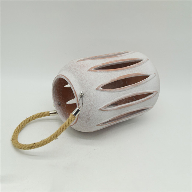 Meilleure vente de nouveau cylindre en céramique de couleur évidant le style de moulin à vent évidant la lanterne d'ouragan