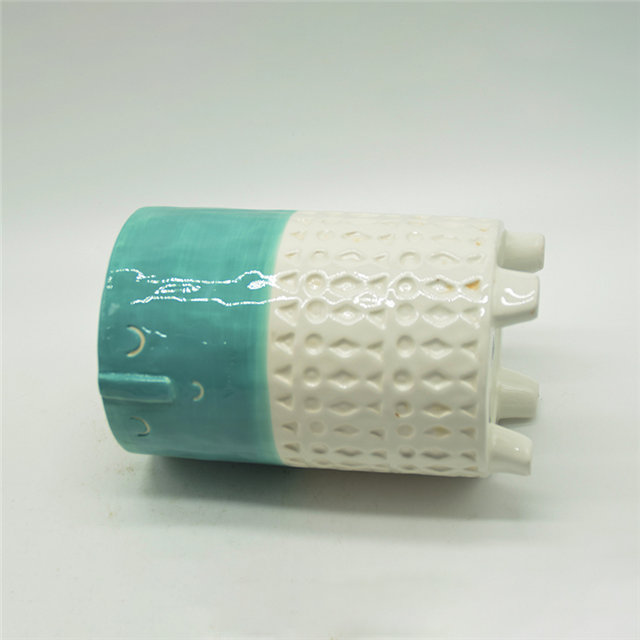 Vase en céramique à quatre jambes d'expression de dessin animé de caractère vert et blanc