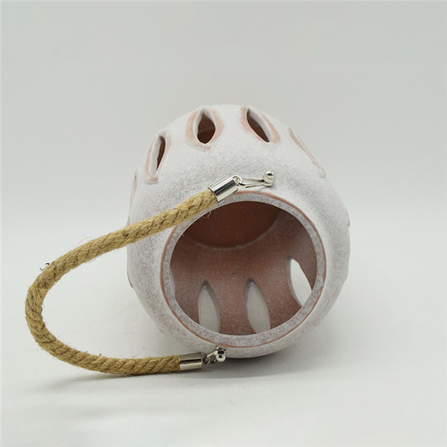 Meilleure vente de nouveau cylindre en céramique de couleur évidant le style de moulin à vent évidant la lanterne d'ouragan