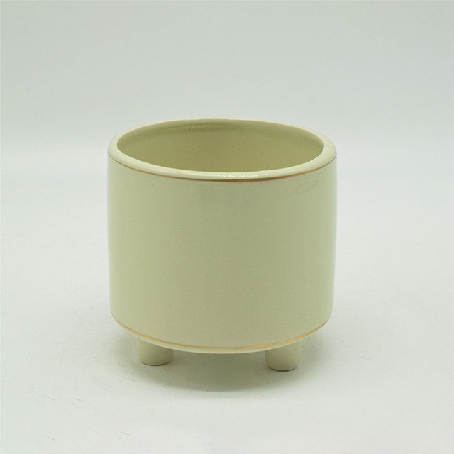 Pot de fleurs jaune clair de dessus de table avec trois pieds Pot de fleur en céramique blanche à trois pieds