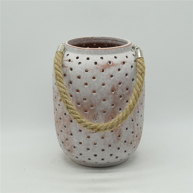 Cylindre en céramique évidant le style de moulin à vent évidant la lanterne d'ouragan